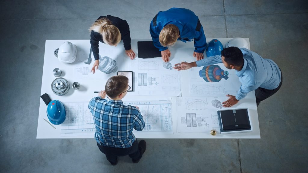 Group of people in a business gathering around table